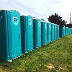 Blue porta potties rented from Event Factory Rentals.
