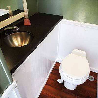 Interior view of bathroom trailer near Goldleaf, CA from Event Factory Rentals.